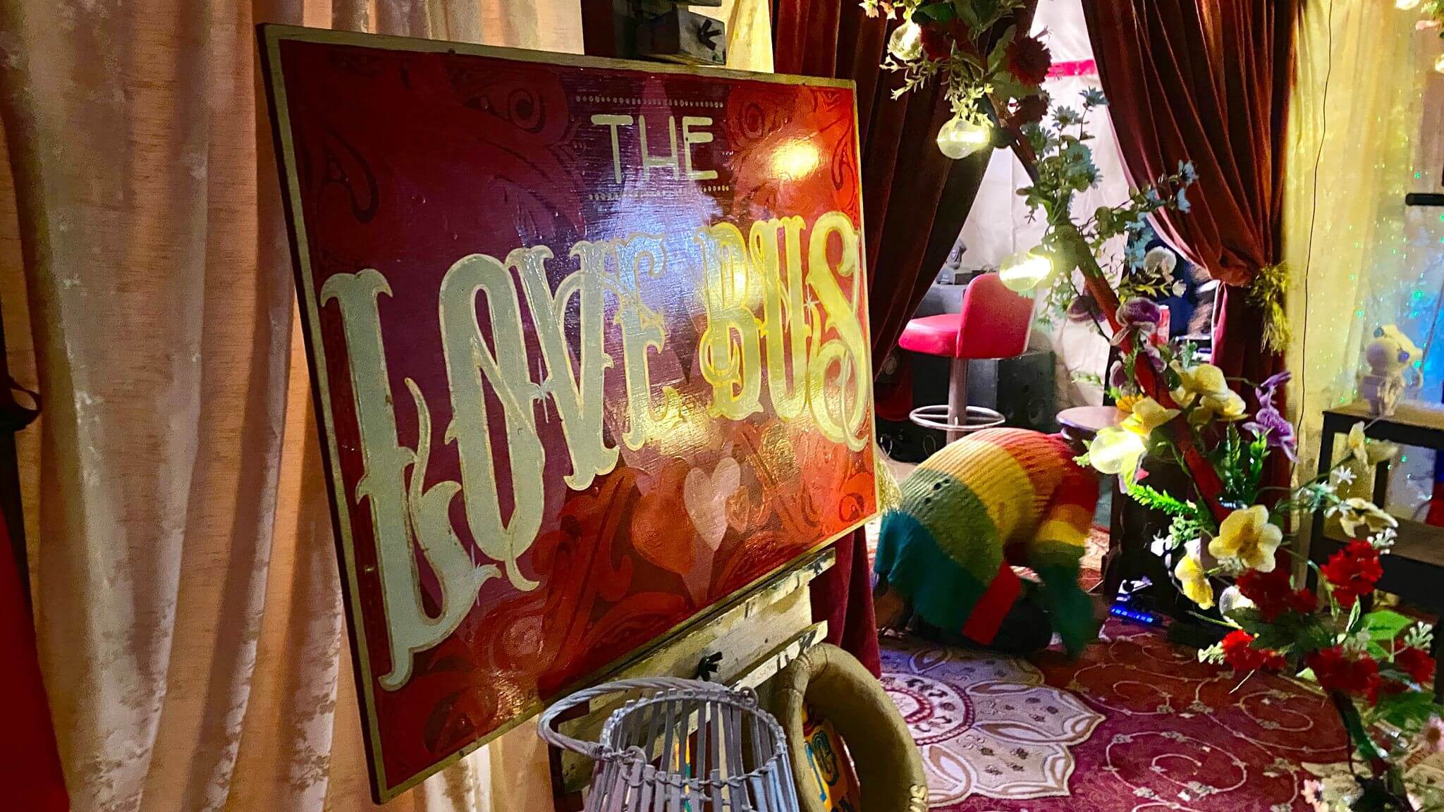 The Love Bus sign at festival
